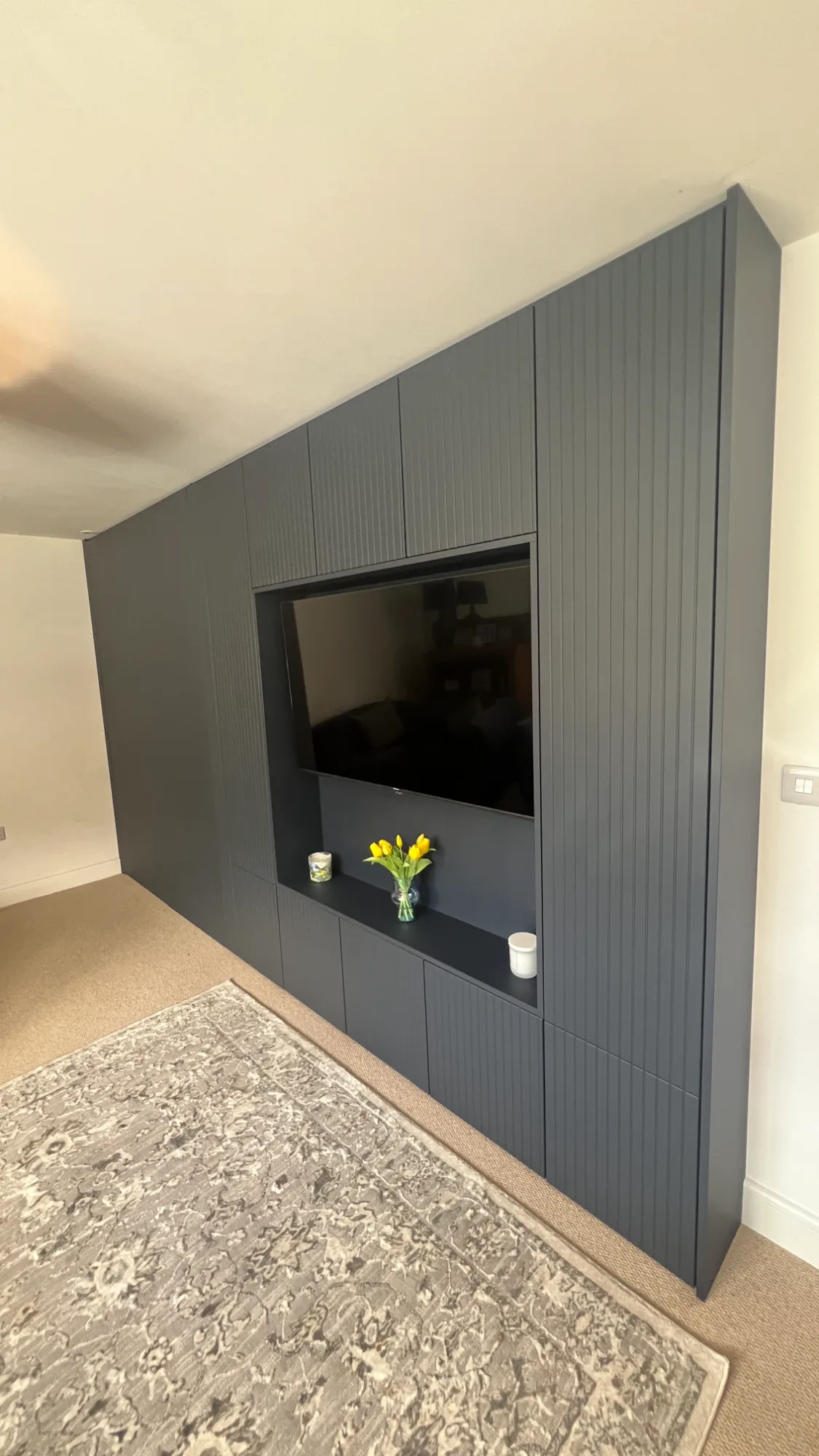 Navy slatted media wall